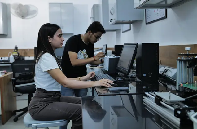 girl coding on laptop